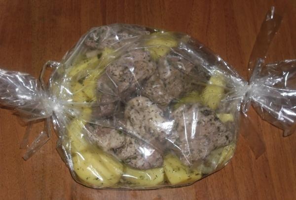 Baked potatoes with meat in the sleeve