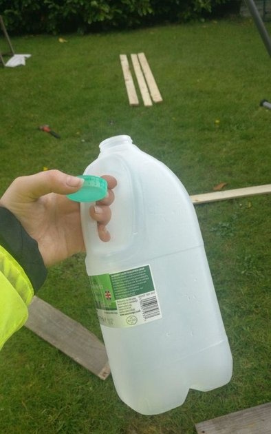 How to make a full-fledged garden watering can from a canister in 2 minutes