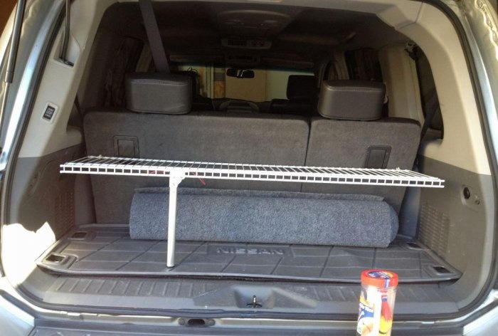 Convenient folding shelf in the trunk of a car